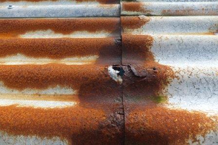 Rusting roof iron from a pitch being too low.